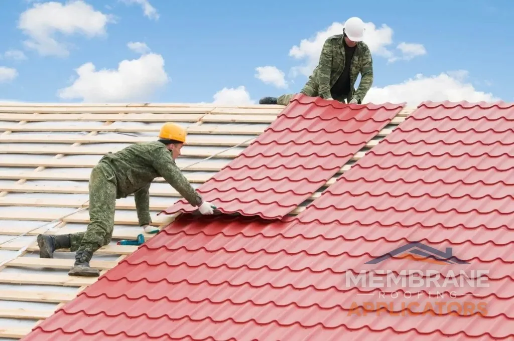 Metal roof installation in Dunedin - professional roofers working